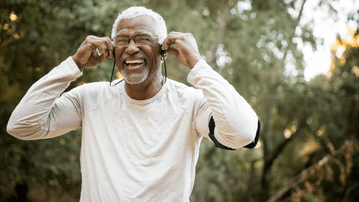 old man listening to music with headphones