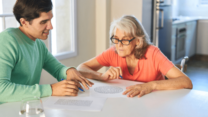 a young man and his mother playing board games