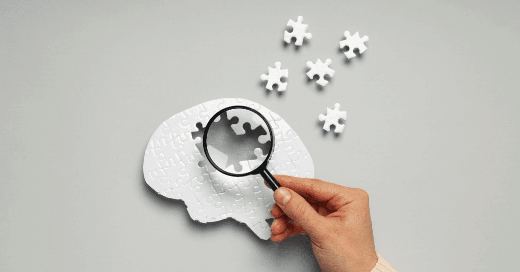 a puzzle brain with pieces coming out of it