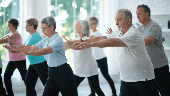 a group of seniors doing yoga