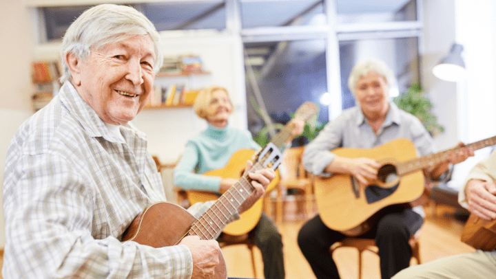 a group of seniors playing guitar