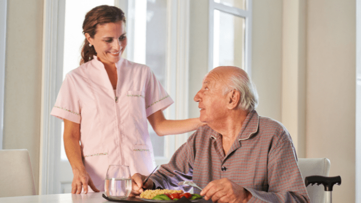 old man eating healthy food in an assisted living