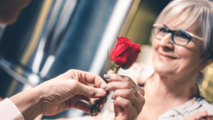 old lady taking a rose