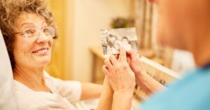 old lady holding a picture