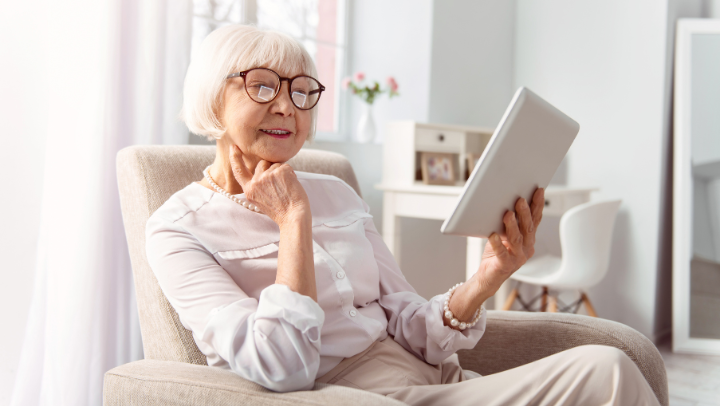 a senior lady reading a book 