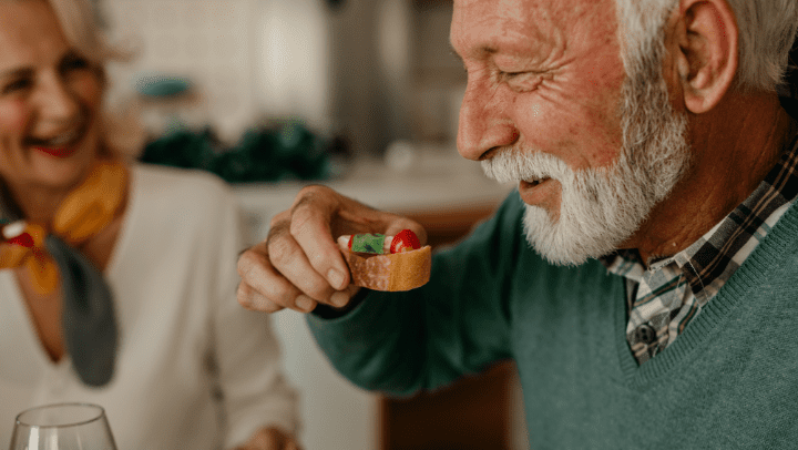 an older adult eating a healthy snack