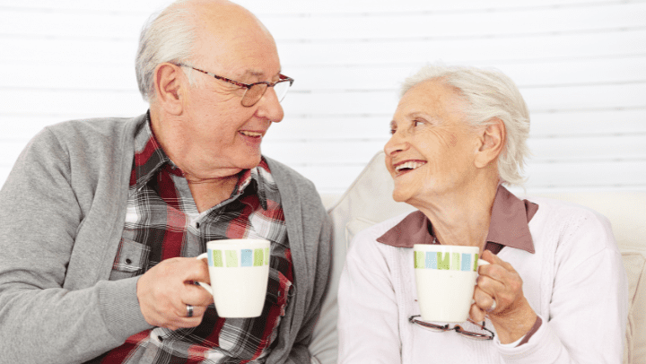 senior couple taking coffee