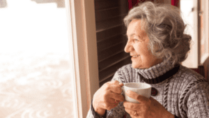 old lady taking a cup of coffee