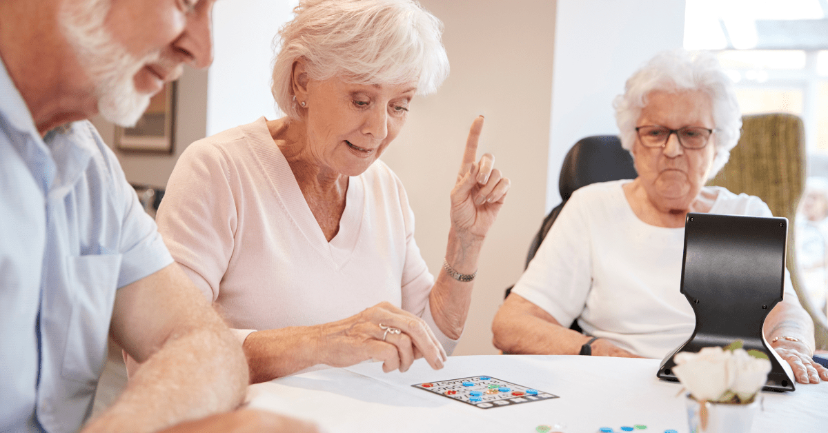a senior group playing bingo at memory care community