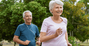 a senior couple running outside