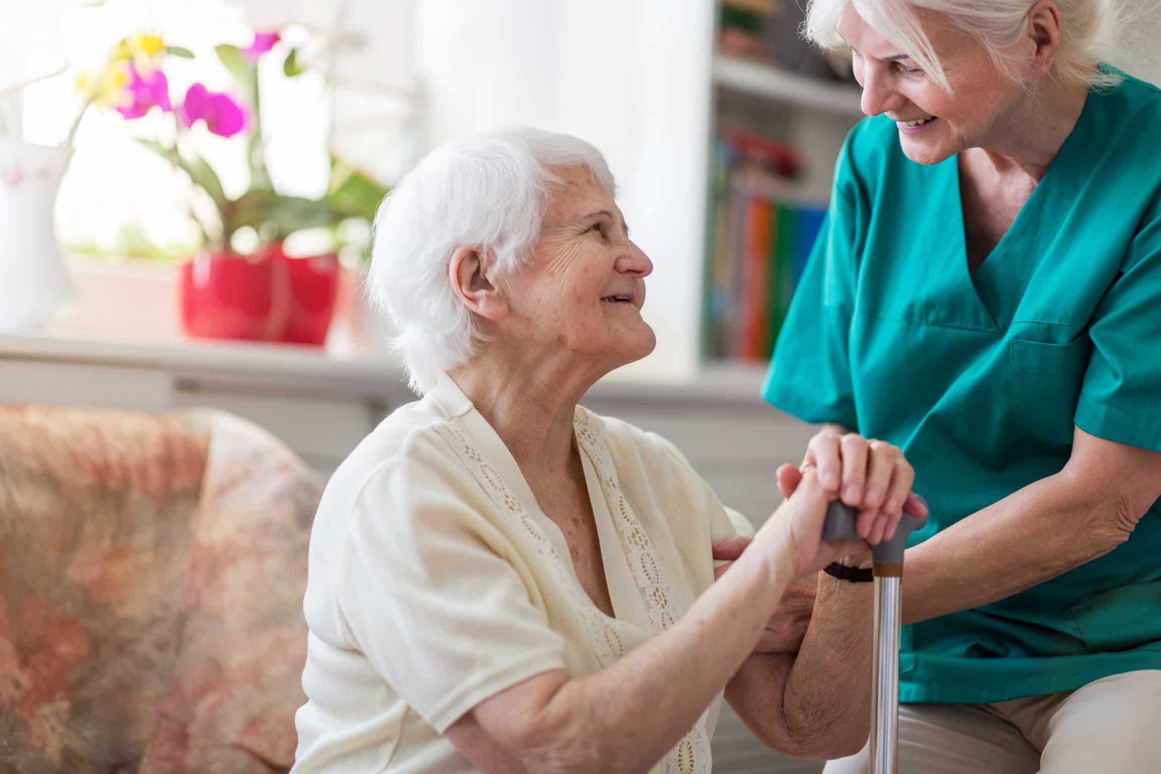 An assisted living caregiver caring for a resident.
