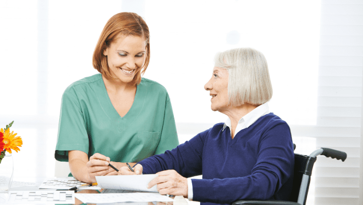 two ladies smiling each other