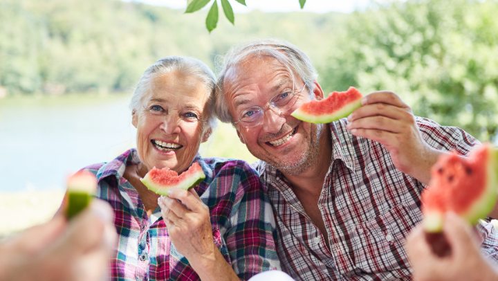 old couple eating watermelon