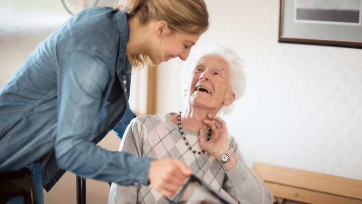a nurse helping a senior lady 