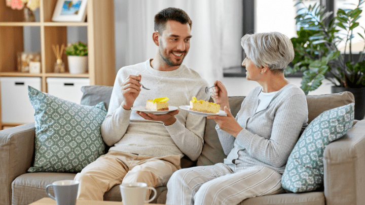 a men having a conversation with his senior mother 