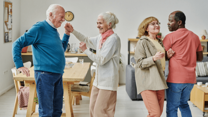 a group of seniors dancing each other