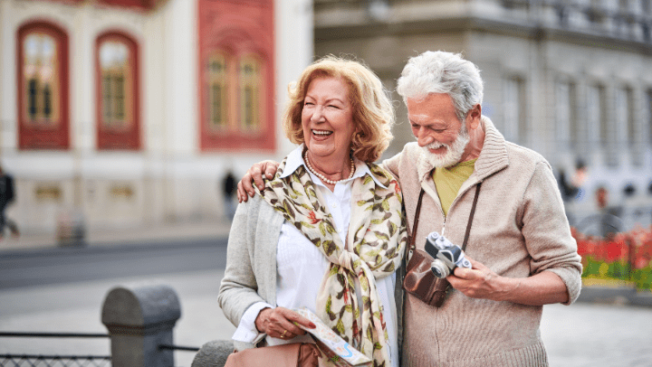 happy couple of seniors traveling