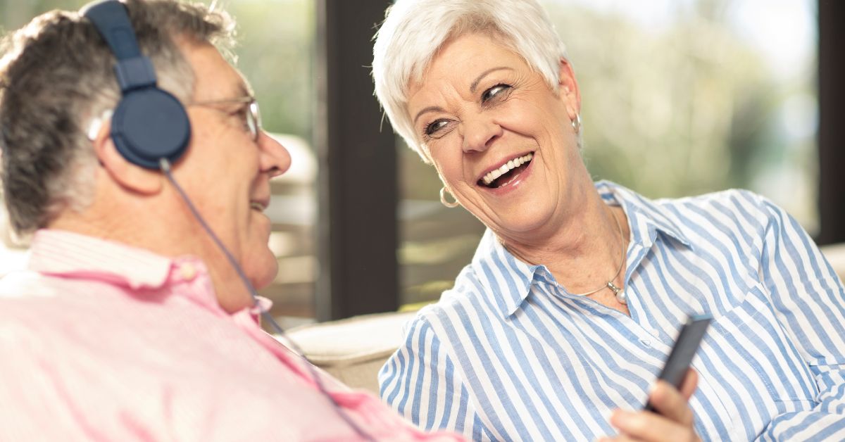 seniors listing to music in assisted living communities
