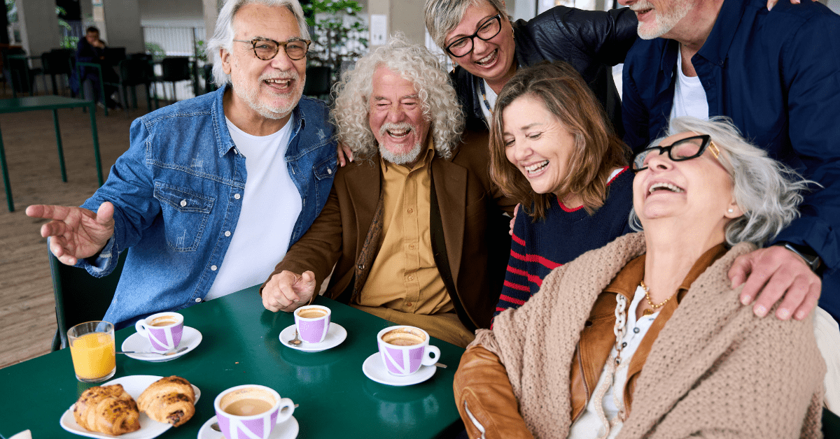 a senior group sharing coffee in assisted living