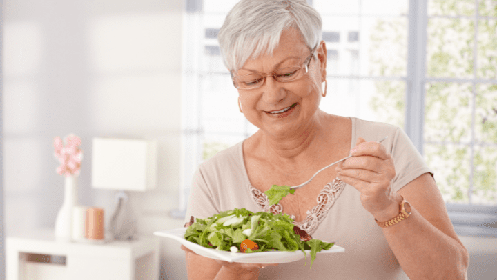 Old woman eating healthy