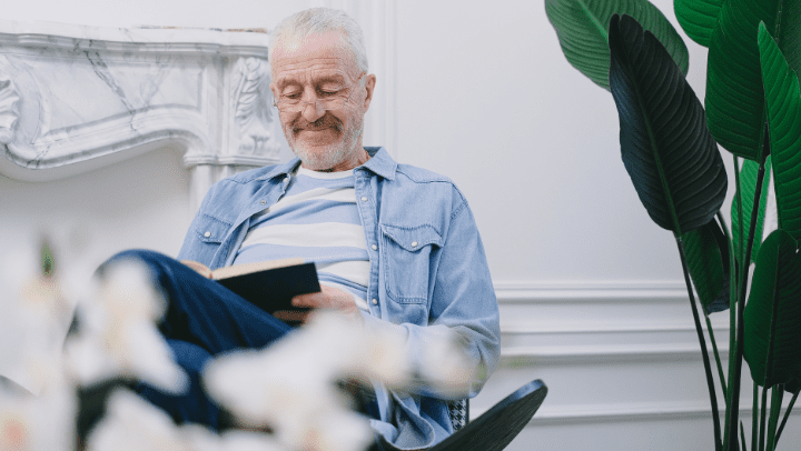 old man reading a book