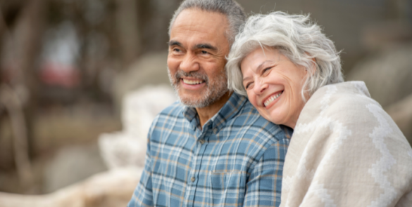a senior couple smiling