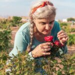 Older woman with flowers in a memory care