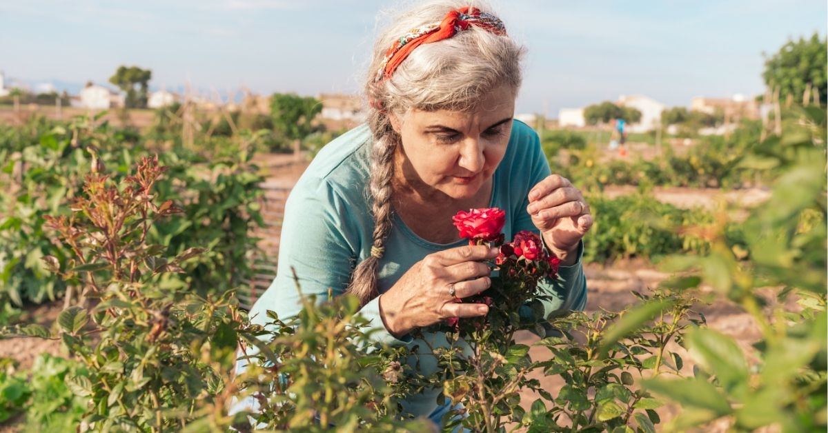 Older woman with flowers in a memory care