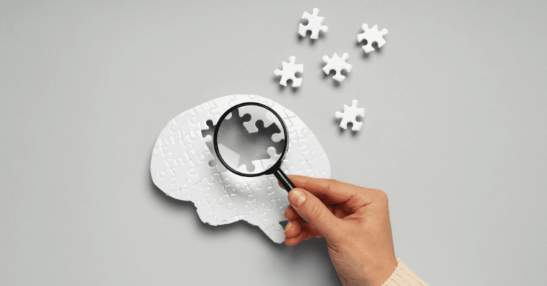 a brain puzzle with pieces coming off it