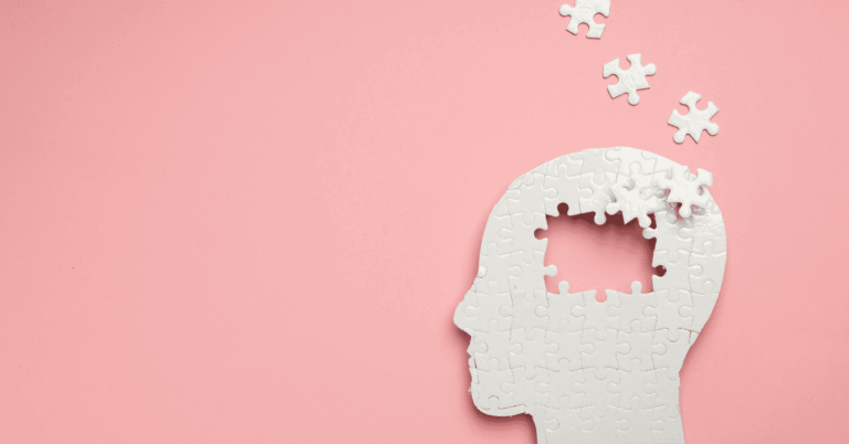 a puzzle of a head with pieces coming out of it