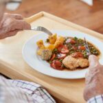 seniors meal in memory care communities