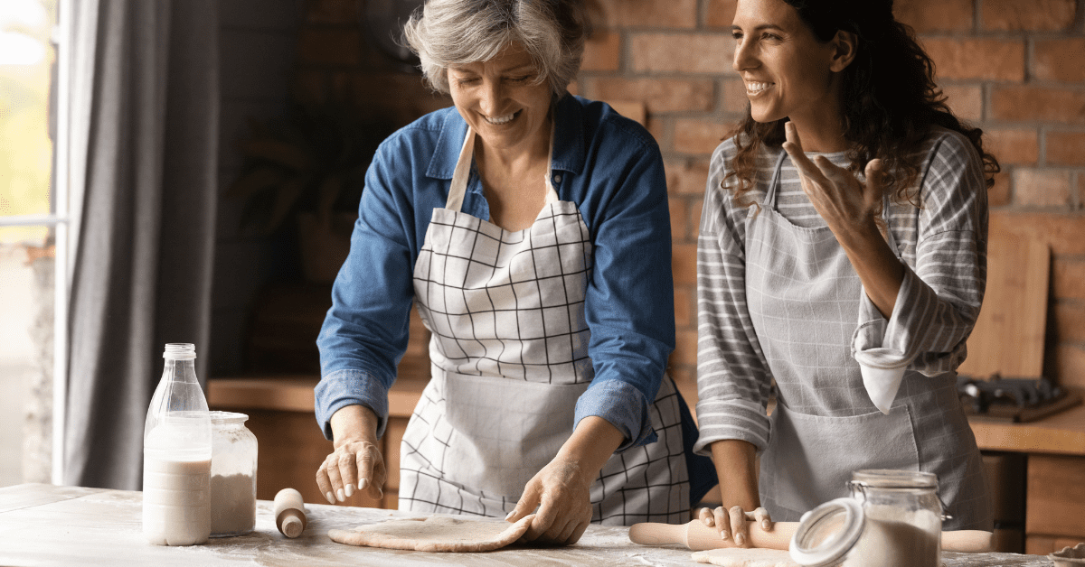 old mom doing pizza with her daughter