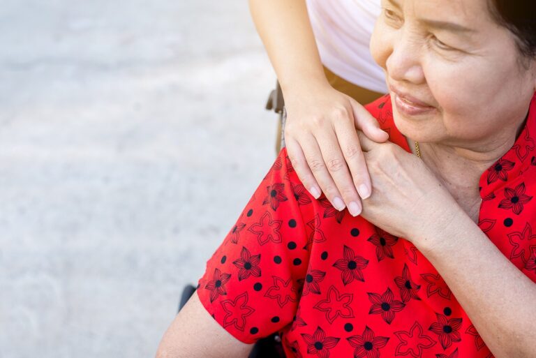 Senior woman with Alzheimer's with caregiver