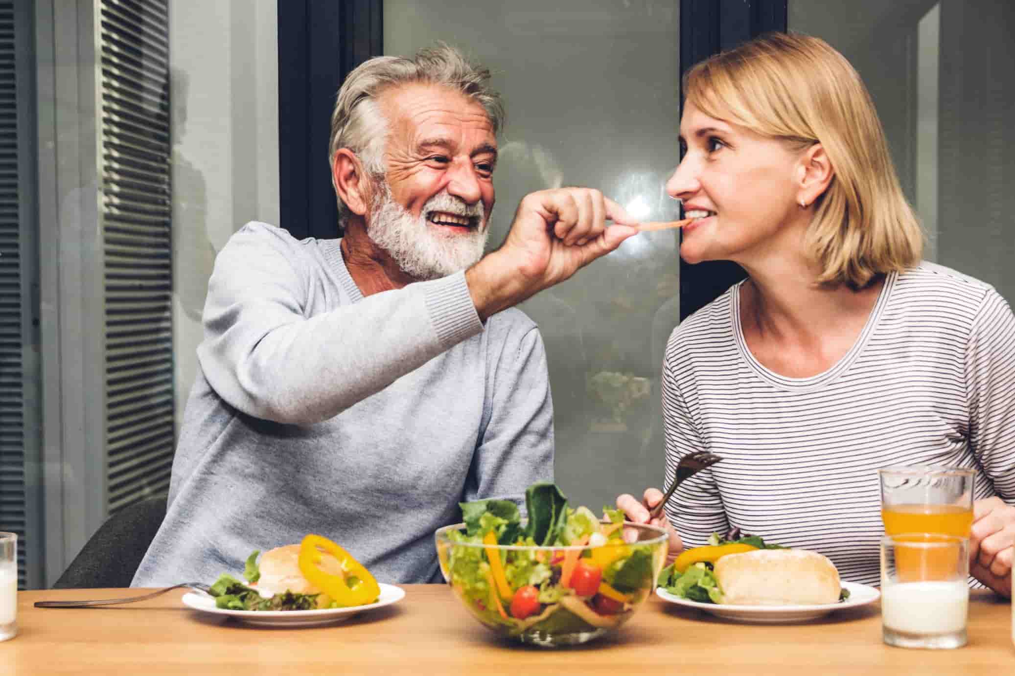 Senior couple sharing a healthy meal together.