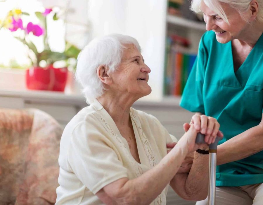 An assisted living caregiver caring for a resident.