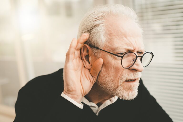 Senior man with hearing issues