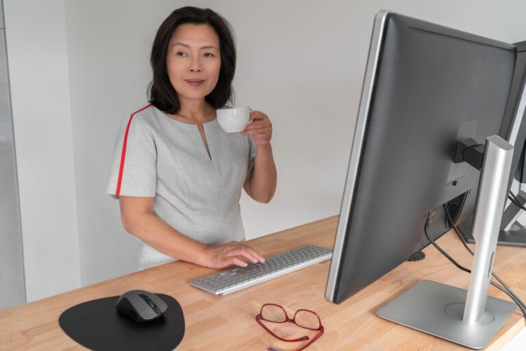Senior woman using her standing desk